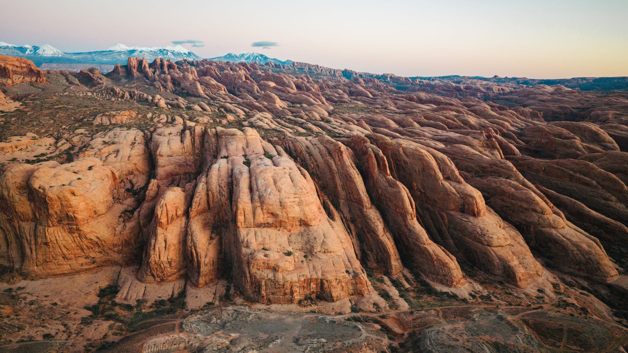 Moab fins rippling toward the La Sals at dusk