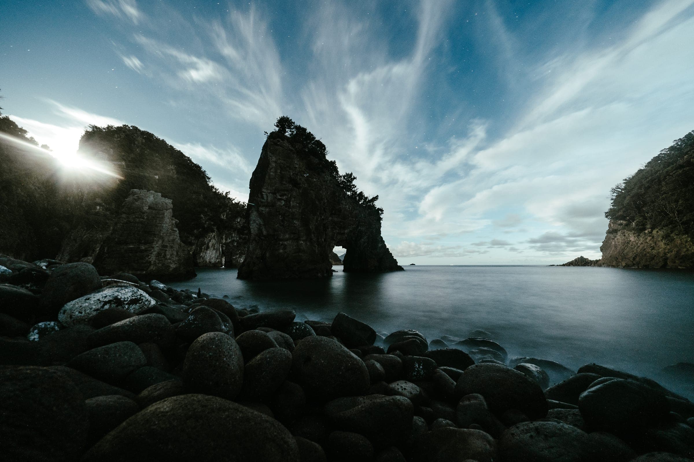 Nishiizu sea arch with streaking cirrus and smoothed water